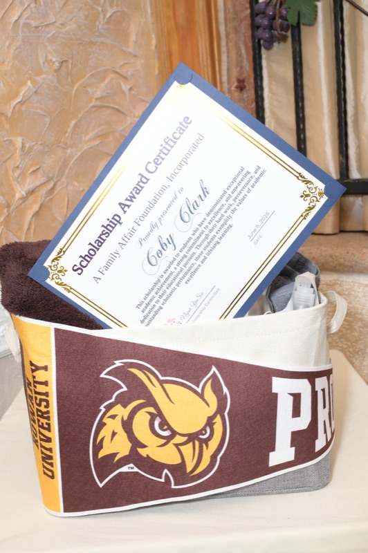 Coby Clark’s scholarship certificate and Rowan University welcome basket