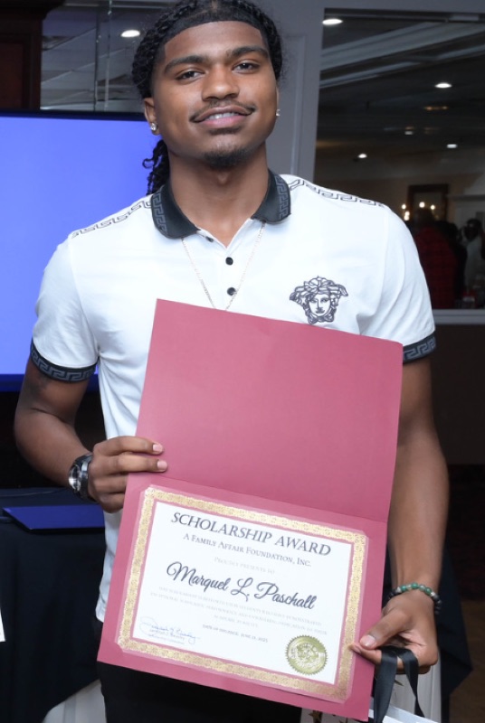 Marquel Paschall with his scholarship award