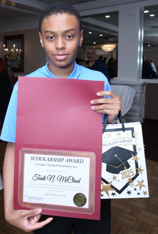 Taali McCleod with his scholarship award